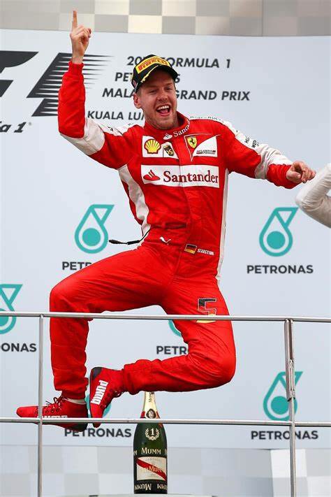 Sebastian Vettel celebrating a Ferrari victory.