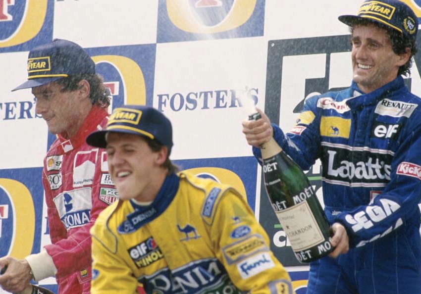 Schumacher, Prost and Senna celebrate on the podium, 